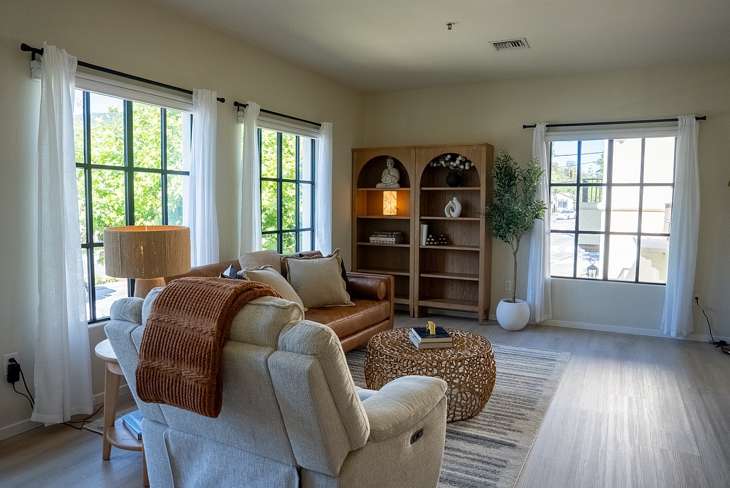 Cozy living room with natural light and decor.