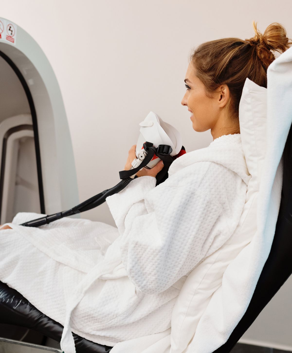 Los Gatos Hyperbaric Oxygen Therapy model in robe ready for treatment session.