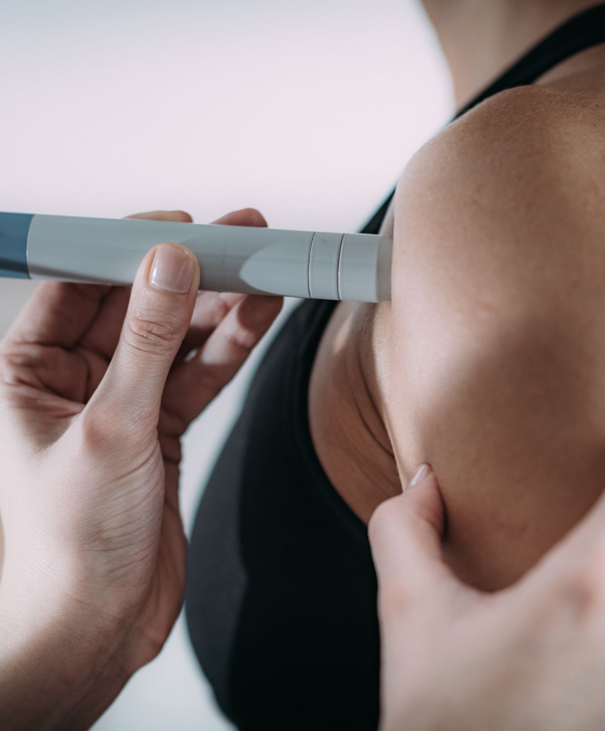 Administering medication with a syringe pen.