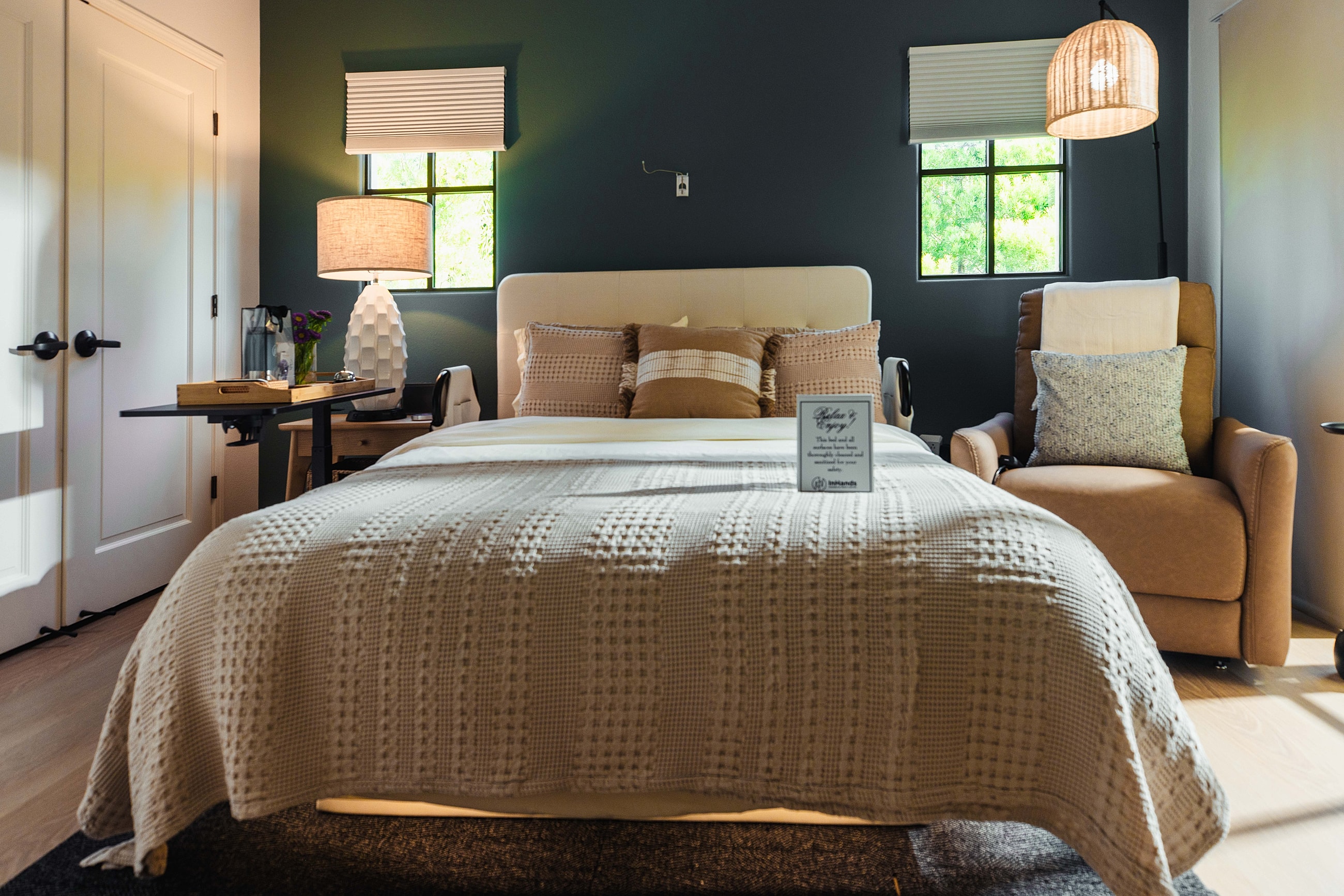 Cozy bedroom with neutral tones and modern decor.