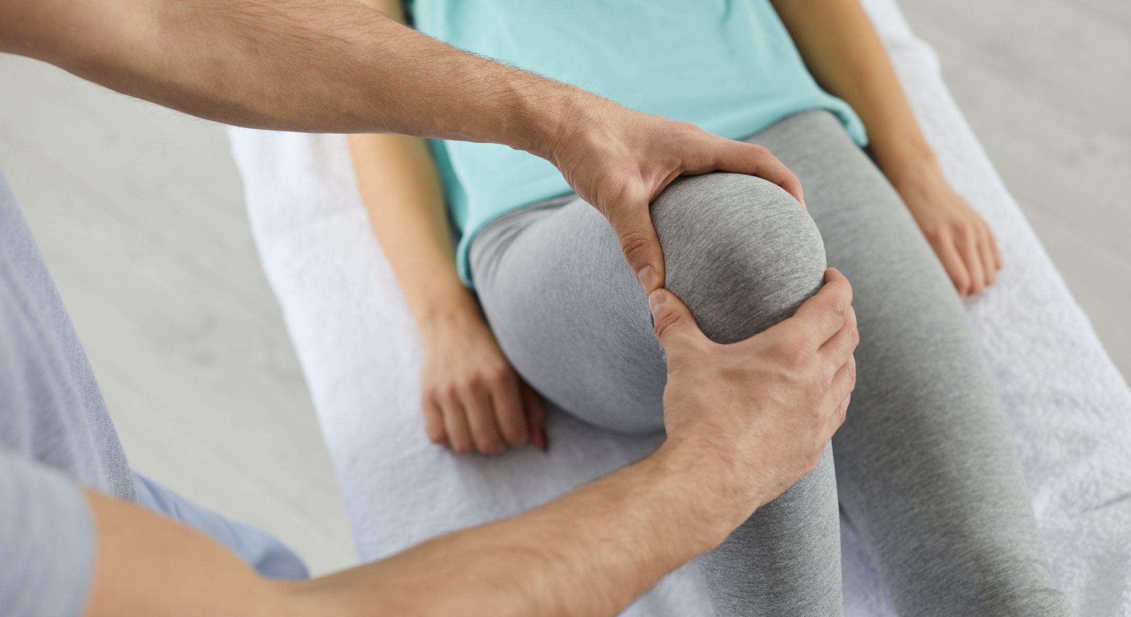 Knee examination during physical therapy session.